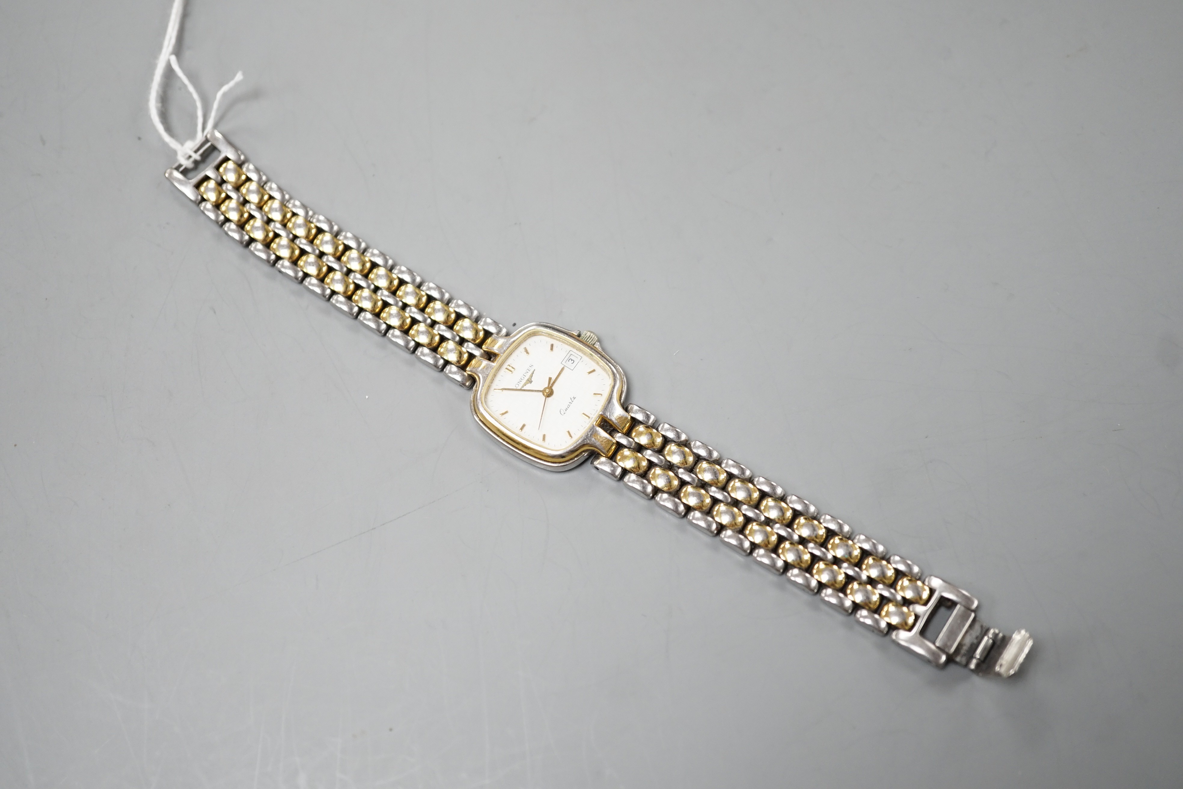 A lady's modern steel and gold plated Longines quartz wrist watch, on a steel and gold plated Longines bracelet.